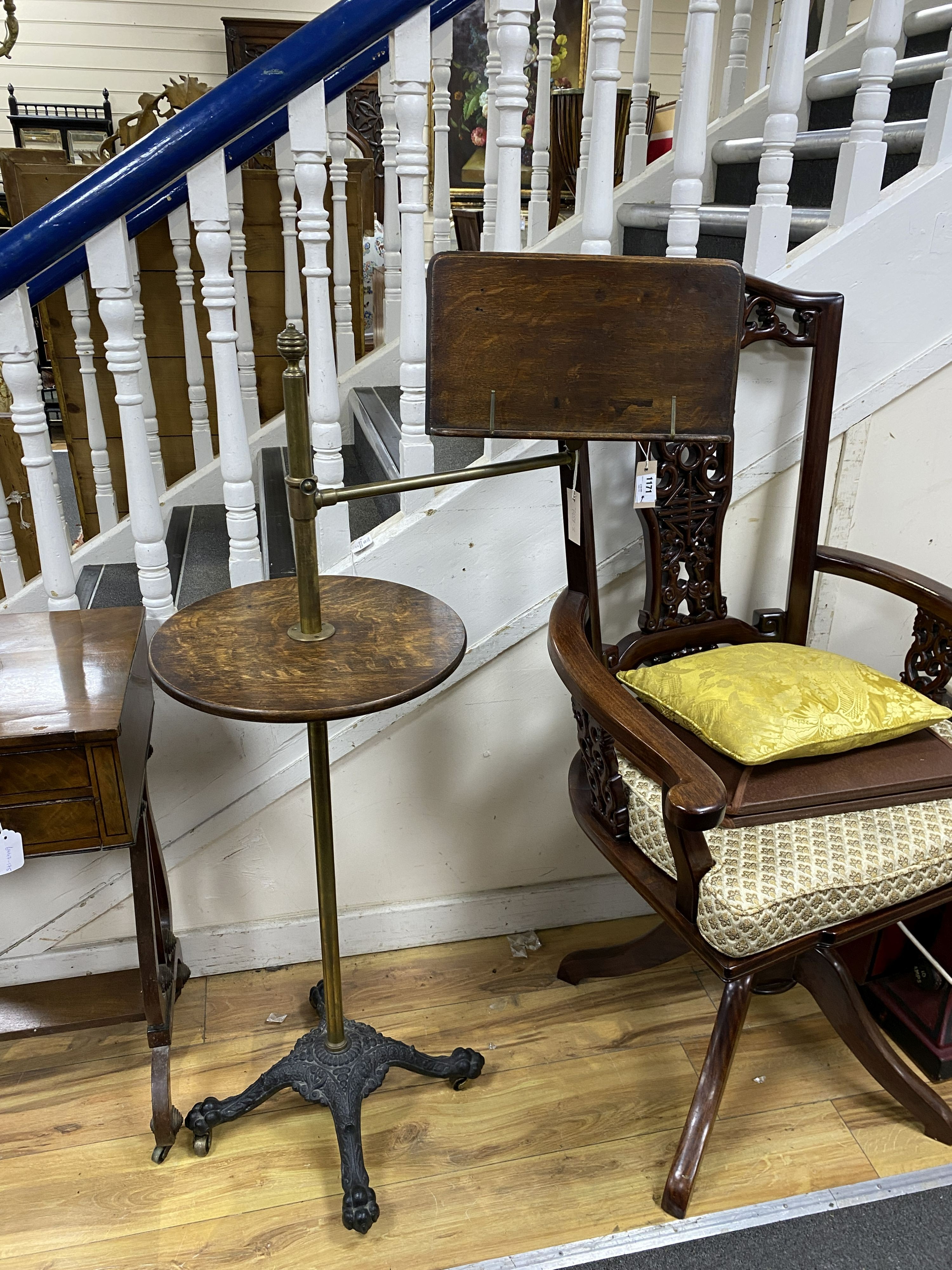A late Victorian brass, oak and cast iron adjustable reading table